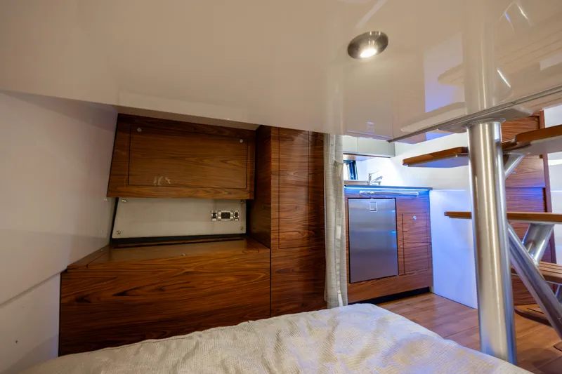 Slide: The Image of Interior of 2021 Boston Whaler 405 Conquest with TV and wood paneling. - 29