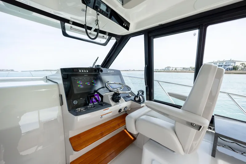 Slide: The Image of Interior of 2021 Boston Whaler 405 Conquest, modern helm station. - 38