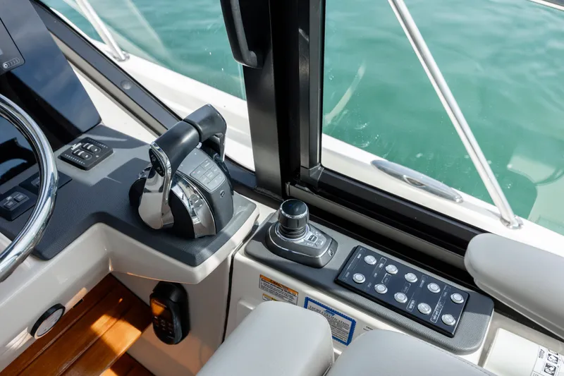 Slide: The Image of 2021 Boston Whaler 405 Conquest helm with controls. - 39