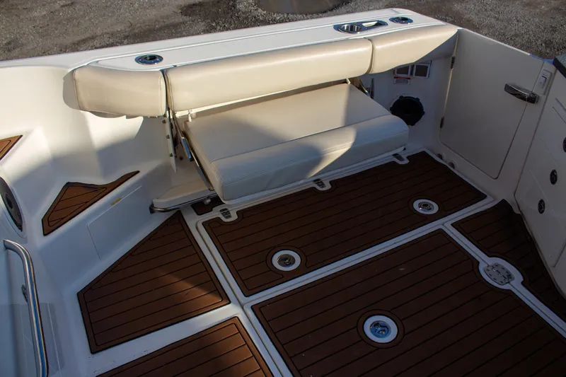 Slide: The Image of 2021 Boston Whaler 405 Conquest boat interior with foldable seating and teak flooring. - 47