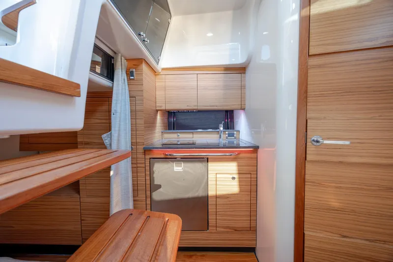 Slide: The Image of Luxurious interior of 2021 Boston Whaler 405 Conquest yacht with modern kitchen amenities. - 51