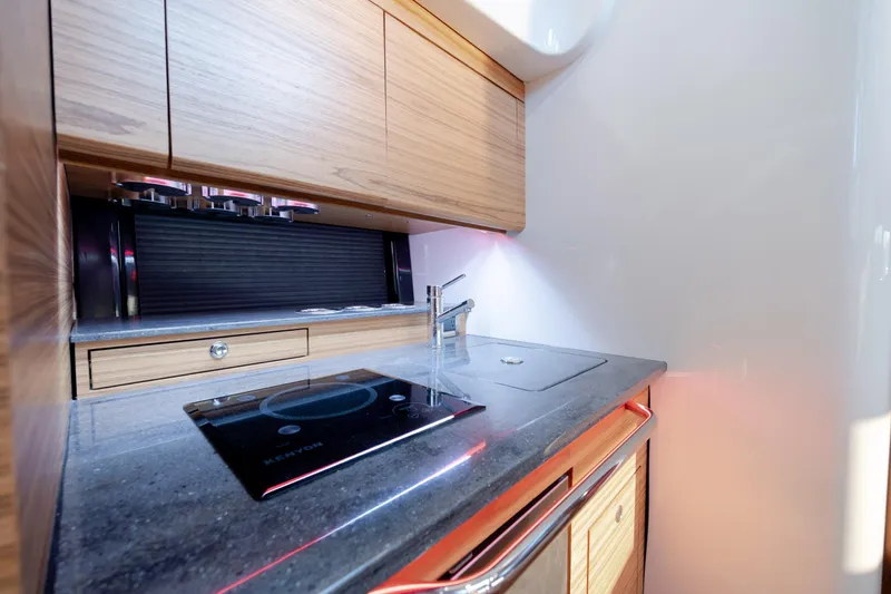 Slide: The Image of Modern kitchen area in 2021 Boston Whaler 405 Conquest boat with sleek design. - 52