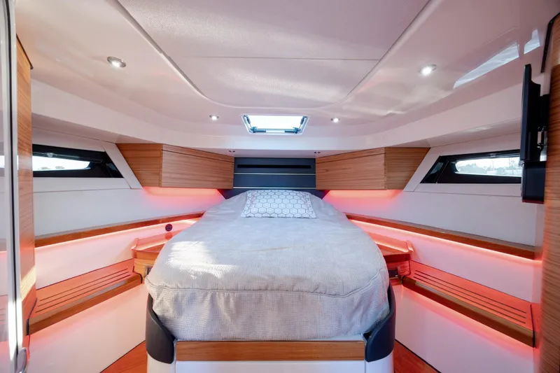 Slide: The Image of Luxurious cabin interior of 2021 Boston Whaler 405 Conquest with ambient lighting and modern design. - 56