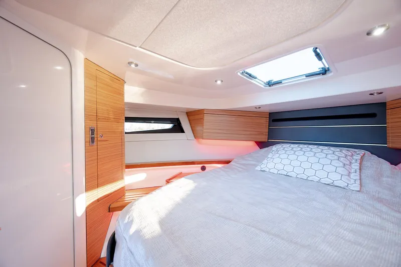 Slide: The Image of Luxurious cabin interior of 2021 Boston Whaler 405 Conquest with modern wood finishes. - 57