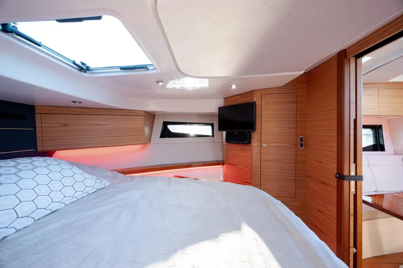 Slide: The Image of Luxurious cabin interior of 2021 Boston Whaler 405 Conquest with modern wood finishes. - 58