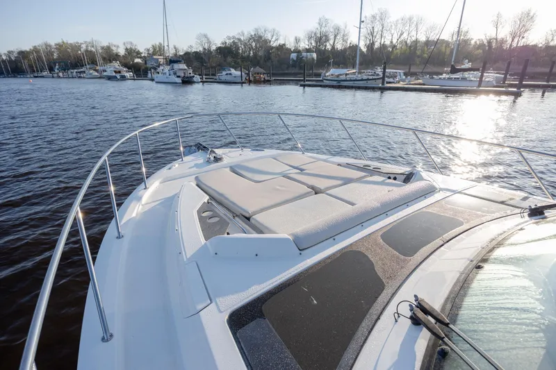 Slide: The Image of Boston Whaler 405 Conquest 2021 yacht docked at marina, sunlit deck view. - 59