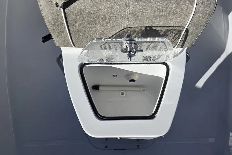 Slide: The Image of 2026 Sea Hunt Ultra 275 Coffin Box interior view with open storage compartment. - 10
