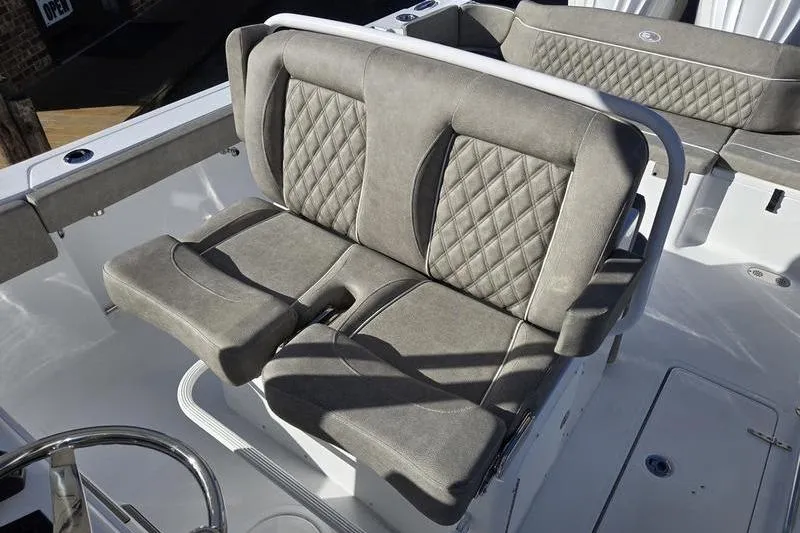 Slide: The Image of 2026 Sea Hunt Ultra 275 Coffin Box boat with cushioned seating and diamond stitching. - 12