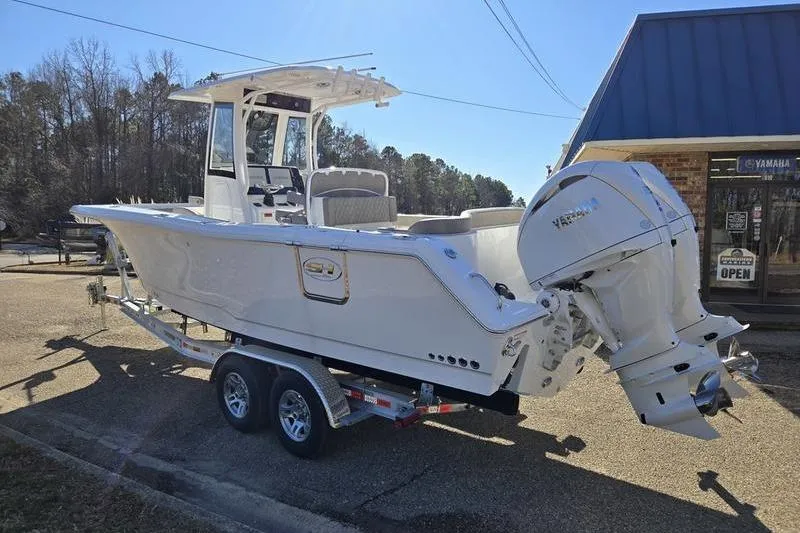 Slide: The Image of 2026 Sea Hunt Ultra 275 Coffin Box boat on trailer, parked outdoors. - 15