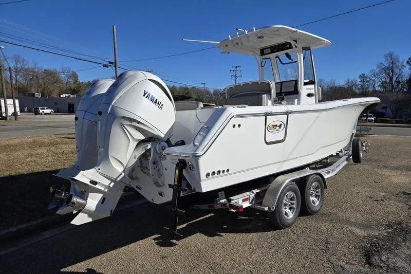 Slide: The Image of 2026 Sea Hunt Ultra 275 Coffin Box boat on trailer, featuring Yamaha engine. - 17