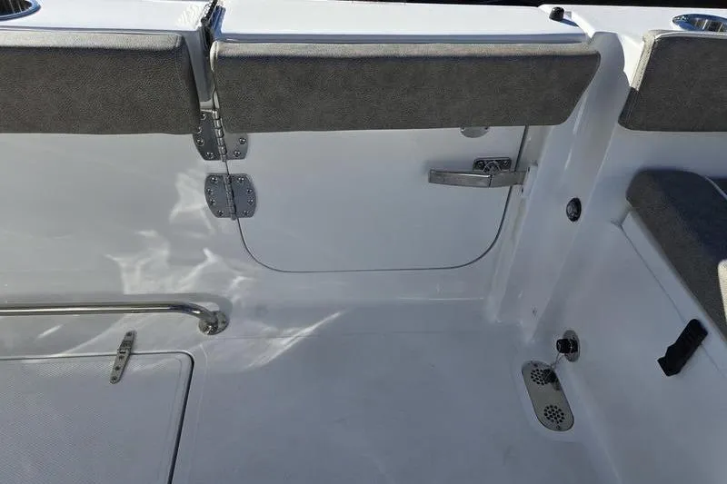 Slide: The Image of Interior view of 2026 Sea Hunt Ultra 275 Coffin Box boat, featuring seating and storage. - 19