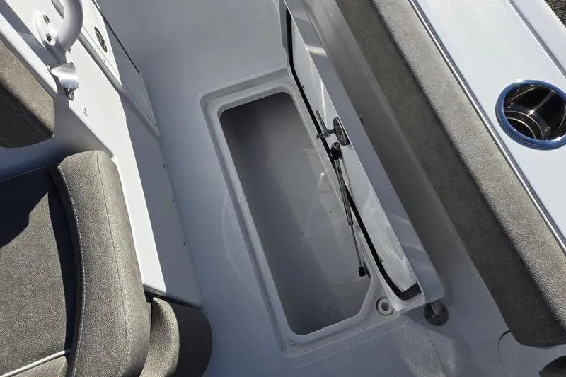 Slide: The Image of 2026 Sea Hunt Ultra 275 Coffin Box interior with open storage compartment. - 2
