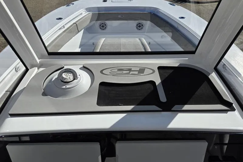 Slide: The Image of 2026 Sea Hunt Ultra 275 Coffin Box boat interior with dashboard and seating area. - 4