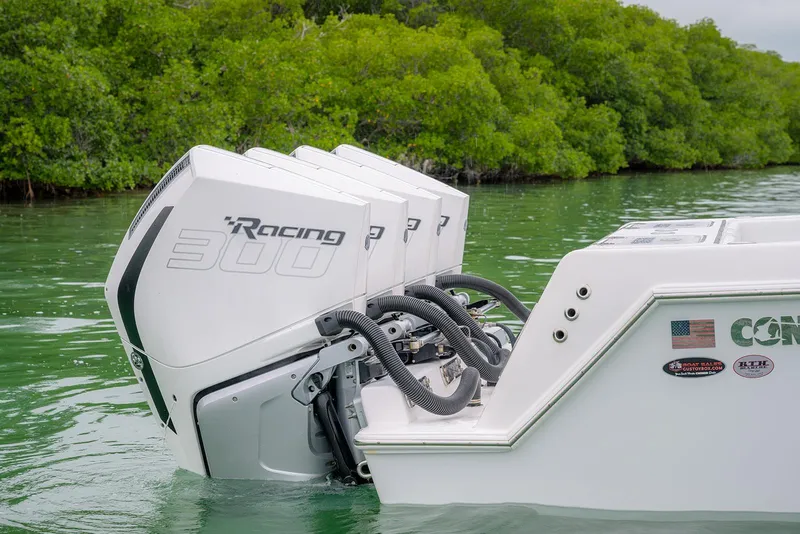 Slide: The Image of 2023 Contender 39 ST boat with powerful Racing 300 engines in scenic waterway. - 12