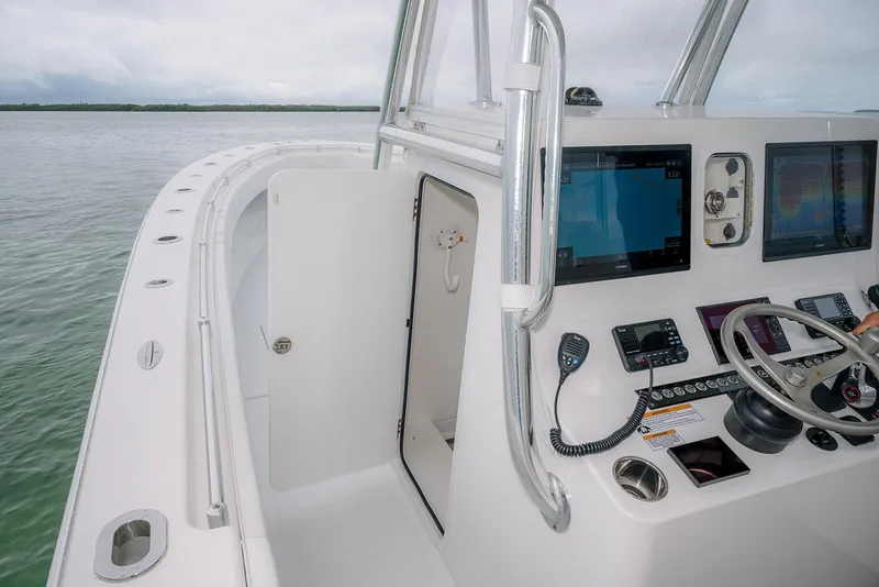 Slide: The Image of 2023 Contender 39 ST boat cockpit with advanced navigation systems and sleek design. - 15