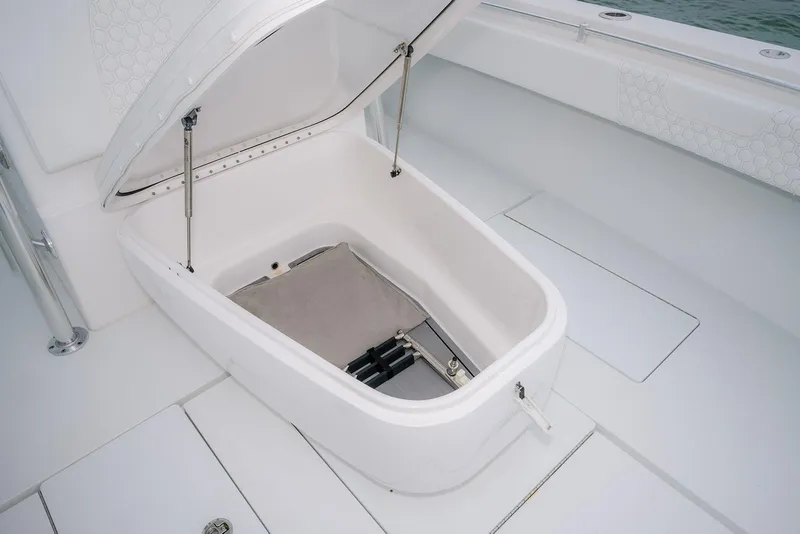 Slide: The Image of Open storage compartment on 2023 Contender 39 ST boat, showcasing interior design. - 25