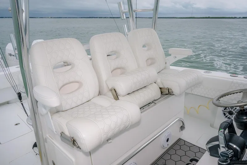Slide: The Image of Luxurious seating on 2023 Contender 39 ST boat, featuring elegant white upholstery. - 29