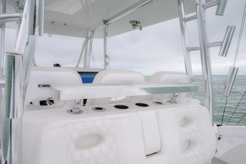 Slide: The Image of 2023 Contender 39 ST boat interior with white seating and rod holders. - 34