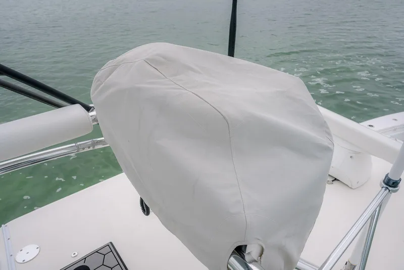 Slide: The Image of 2023 Contender 39 ST boat helm covered, overlooking calm water. - 42