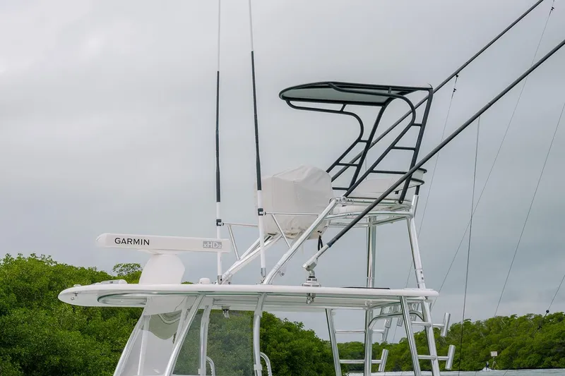 Slide: The Image of 2023 Contender 39 ST boat with Garmin radar and tower against cloudy sky. - 6