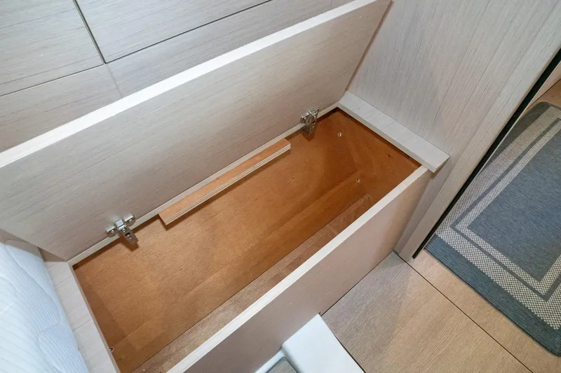 Slide: The Image of Storage compartment on 2022 Beneteau Oceanis 461 yacht, featuring wooden interior and modern design. - 10