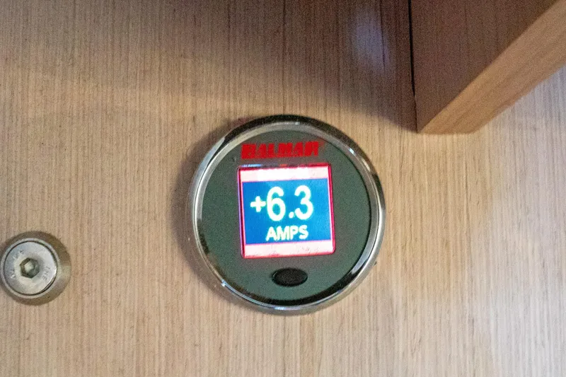 Slide: The Image of Digital ammeter displaying +6.3 amps on Beneteau Oceanis 461, 2022 model. - 15