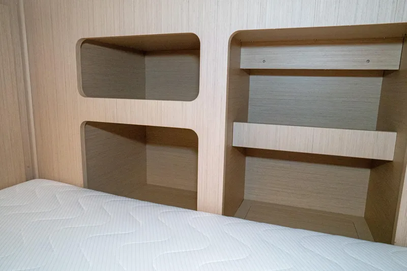 Slide: The Image of Interior storage shelves and bed in 2022 Beneteau Oceanis 461 yacht cabin. - 19