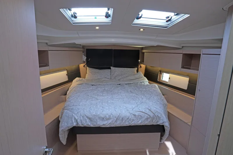 Slide: The Image of Luxurious cabin interior of 2022 Beneteau Oceanis 461 yacht with skylights and cozy bedding. - 20