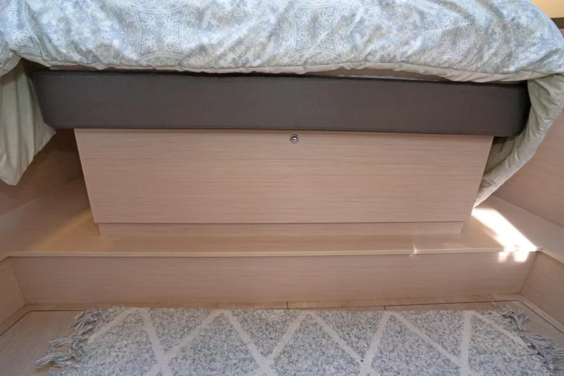 Slide: The Image of Beneteau Oceanis 461 2022 interior cabin with bed and patterned bedding. - 22