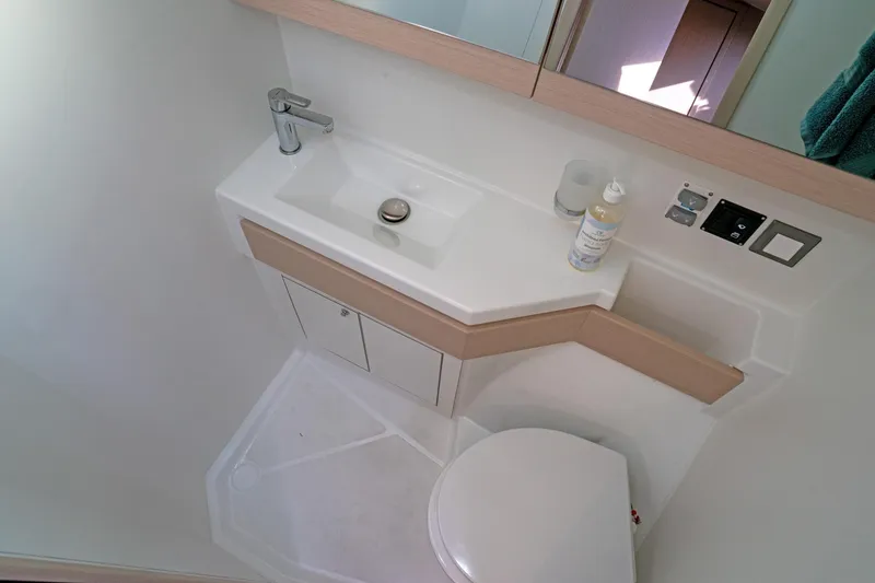 Slide: The Image of Bathroom interior of 2022 Beneteau Oceanis 461 yacht, featuring modern sink and toilet. - 23