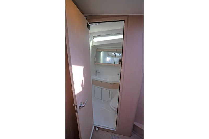 Slide: The Image of Interior view of 2022 Beneteau Oceanis 461 yacht bathroom with modern fixtures. - 24