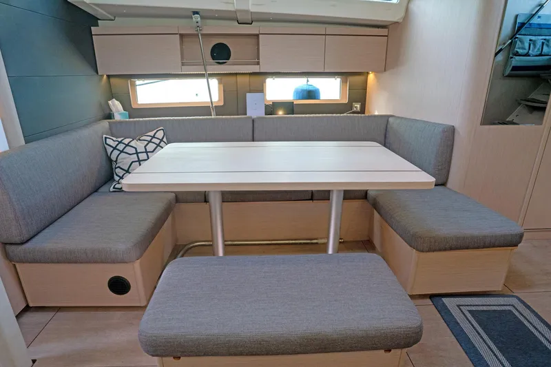 Slide: The Image of Modern interior of 2022 Beneteau Oceanis 461 yacht with cozy seating and dining area. - 3