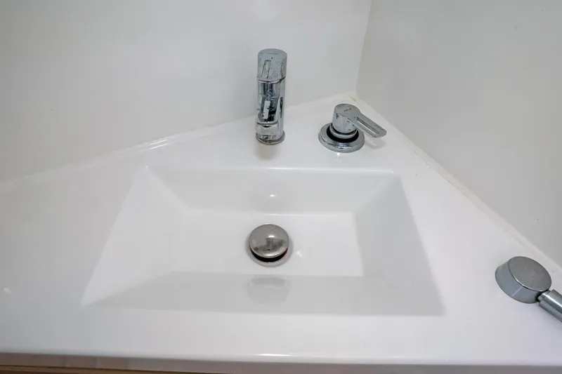 Slide: The Image of Modern sink with chrome faucet in 2022 Beneteau Oceanis 461 yacht bathroom. - 34