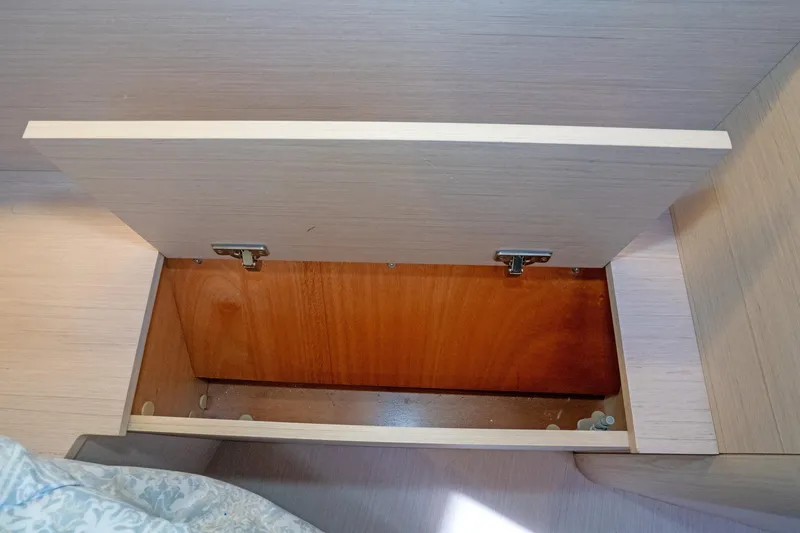 Slide: The Image of Open storage compartment on 2022 Beneteau Oceanis 461 yacht interior. - 36