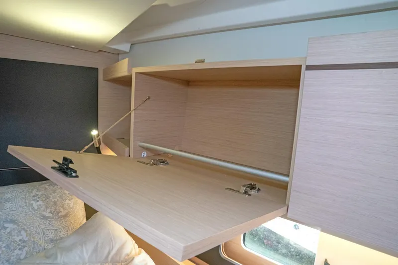 Slide: The Image of Interior storage cabinet in 2022 Beneteau Oceanis 461 yacht, featuring light wood finish. - 39