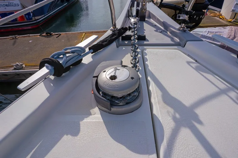 Slide: The Image of Deck of 2022 Beneteau Oceanis 461 sailboat with anchor chain and winch. - 41