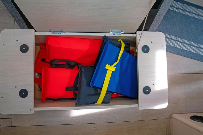 Slide: The Image of Storage compartment with life jackets on a 2022 Beneteau Oceanis 461 yacht. - 44