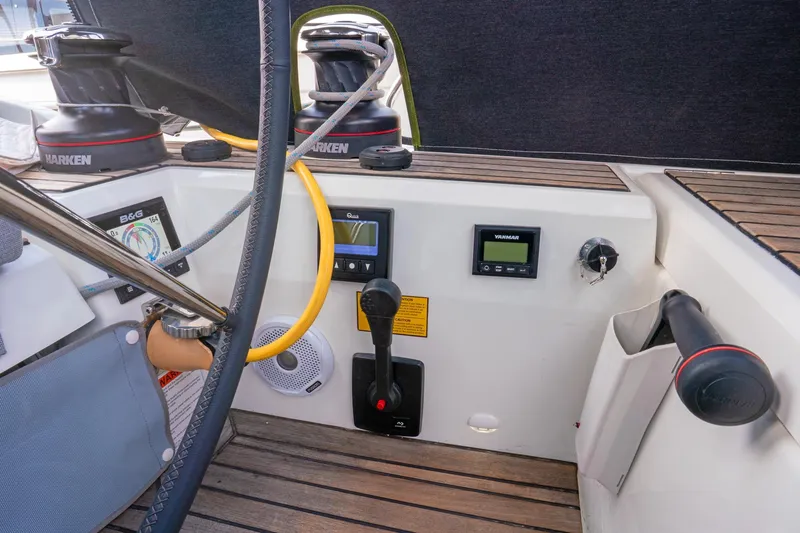 Slide: The Image of Cockpit controls of 2022 Beneteau Oceanis 461 sailboat with Harken winches and navigation instruments. - 60