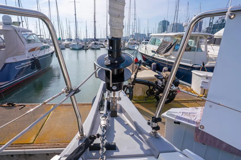 Slide: The Image of Beneteau Oceanis 461 sailboat docked in a marina, surrounded by other boats. - 67