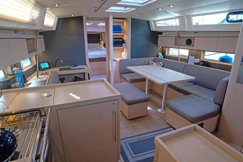 Slide: The Image of Luxurious interior of 2022 Beneteau Oceanis 461 yacht with modern kitchen and seating area. - 7