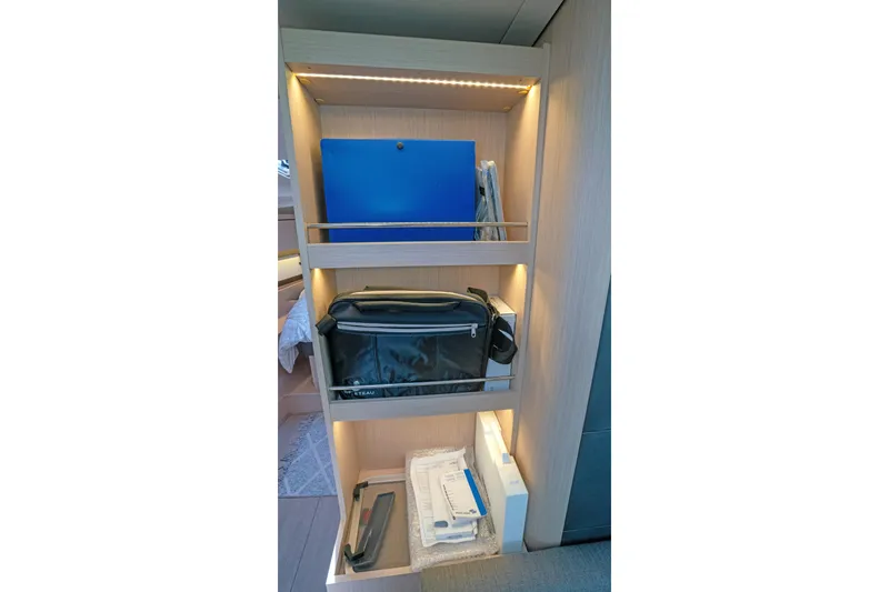 Slide: The Image of Interior shelving on 2022 Beneteau Oceanis 461 yacht with organized storage compartments. - 70