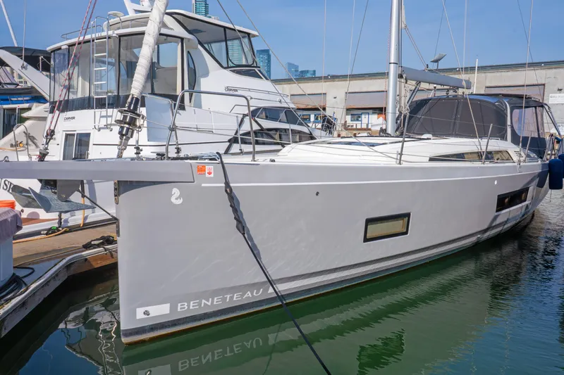 Slide: The Image of 2022 Beneteau Oceanis 461 sailboat docked at marina, showcasing sleek design and modern features. - 71