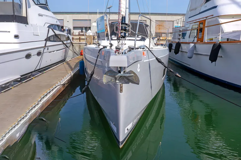 Slide: The Image of Beneteau Oceanis 461 yacht, 2022 model, docked between boats in a marina. - 73