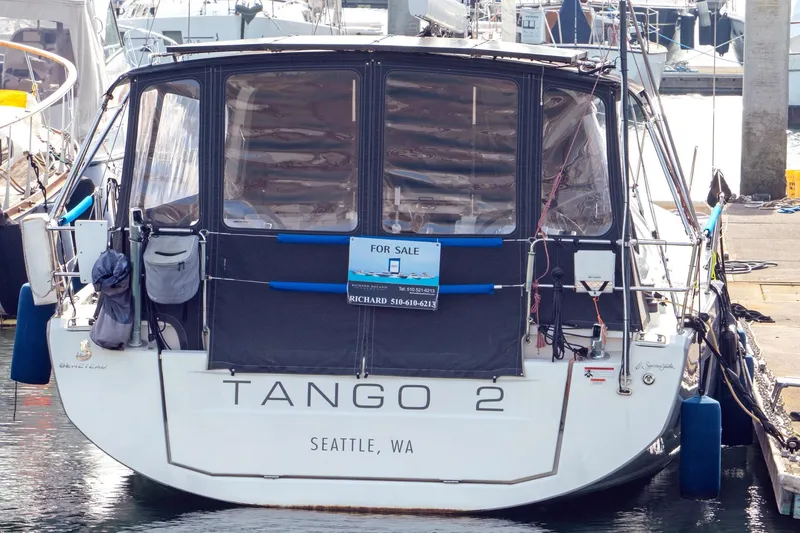 Slide: The Image of Beneteau Oceanis 461 sailboat, 2022 model, docked in Seattle, WA, with "For Sale" sign. - 77