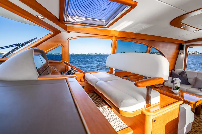 Slide: The Image of Luxurious interior of 2020 Palm Beach Motor Yachts PB55 with elegant wood finish and waterfront view. - 14