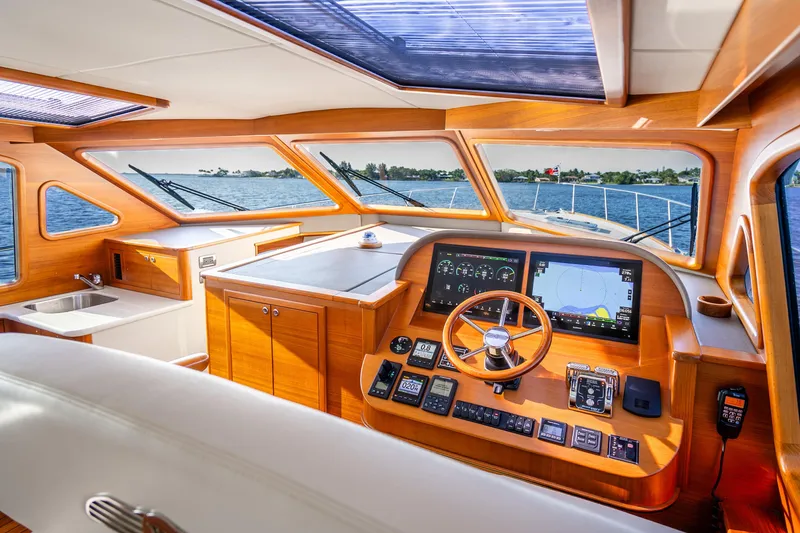 Slide: The Image of Luxurious 2020 Palm Beach Motor Yachts PB55 helm with modern navigation systems and panoramic views. - 16