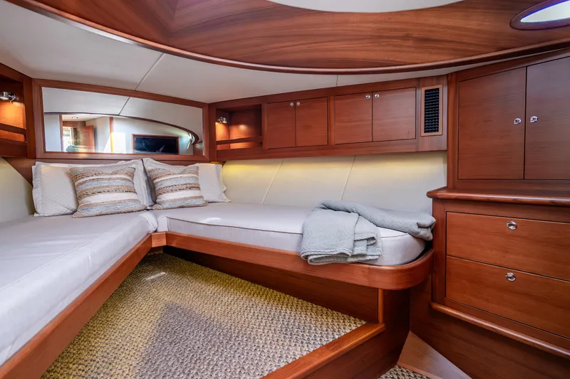 Slide: The Image of Luxurious interior cabin of 2020 Palm Beach Motor Yachts PB55, featuring elegant wood finishes. - 27
