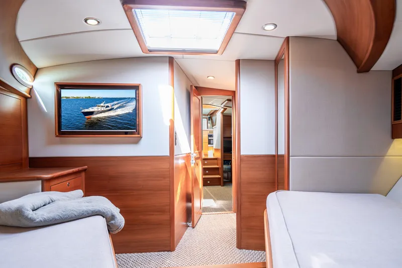Slide: The Image of Luxurious 2020 Palm Beach Motor Yachts PB55 cabin interior with elegant wood finishes. - 28