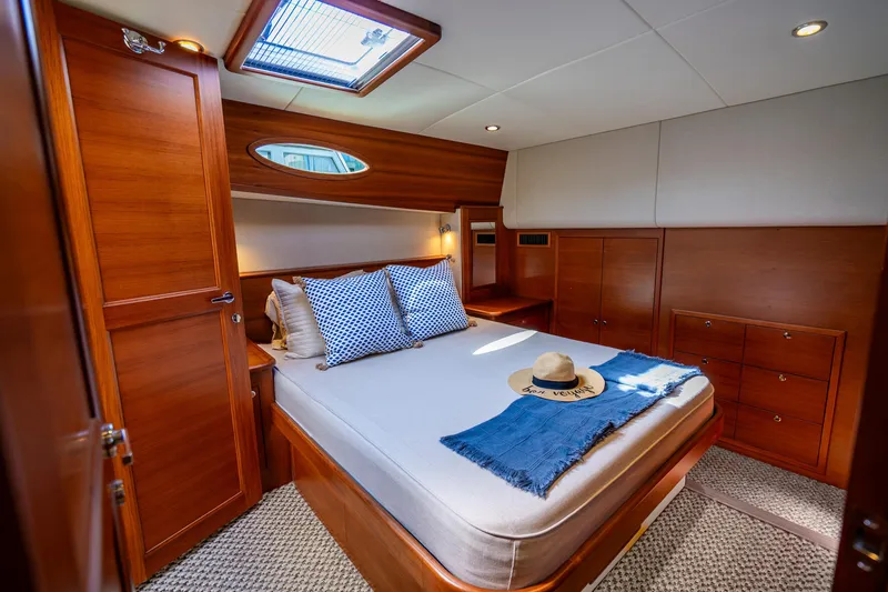 Slide: The Image of Luxurious cabin interior of 2020 Palm Beach Motor Yachts PB55, featuring elegant wood finishes. - 3