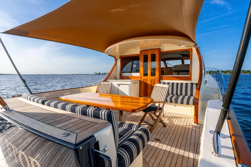 Slide: The Image of 2020 Palm Beach Motor Yachts PB55 with elegant deck seating and ocean view. - 31